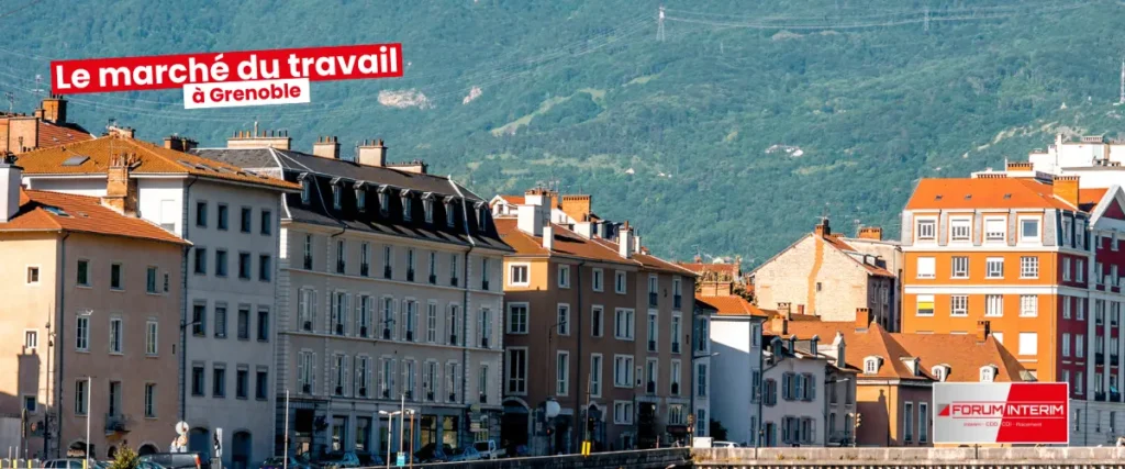 Vue panoramique de Grenoble avec ses bâtiments modernes et son environnement montagnard.